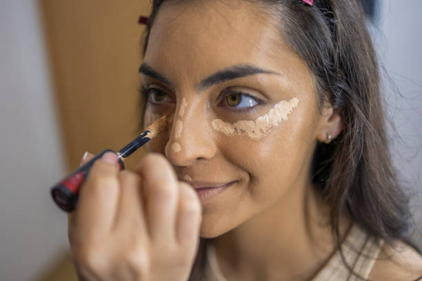 Professional technique for applying concealer with a brush
